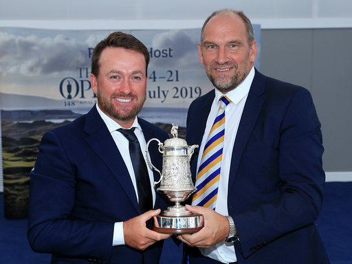 PORTRUSH, NORTHERN IRELAND - JULY 16: Graeme McDowell of Northern Ireland receives the Arnold Palmer AGW Open Award from Martin Dempster the chairman of the Association of Golf Writers during the Association of Golf Writers Annual Dinner and Awards at Royal Portrush Golf Club on July 16, 2019 in Portrush, Northern Ireland. (Photo by David Cannon/Getty Images)