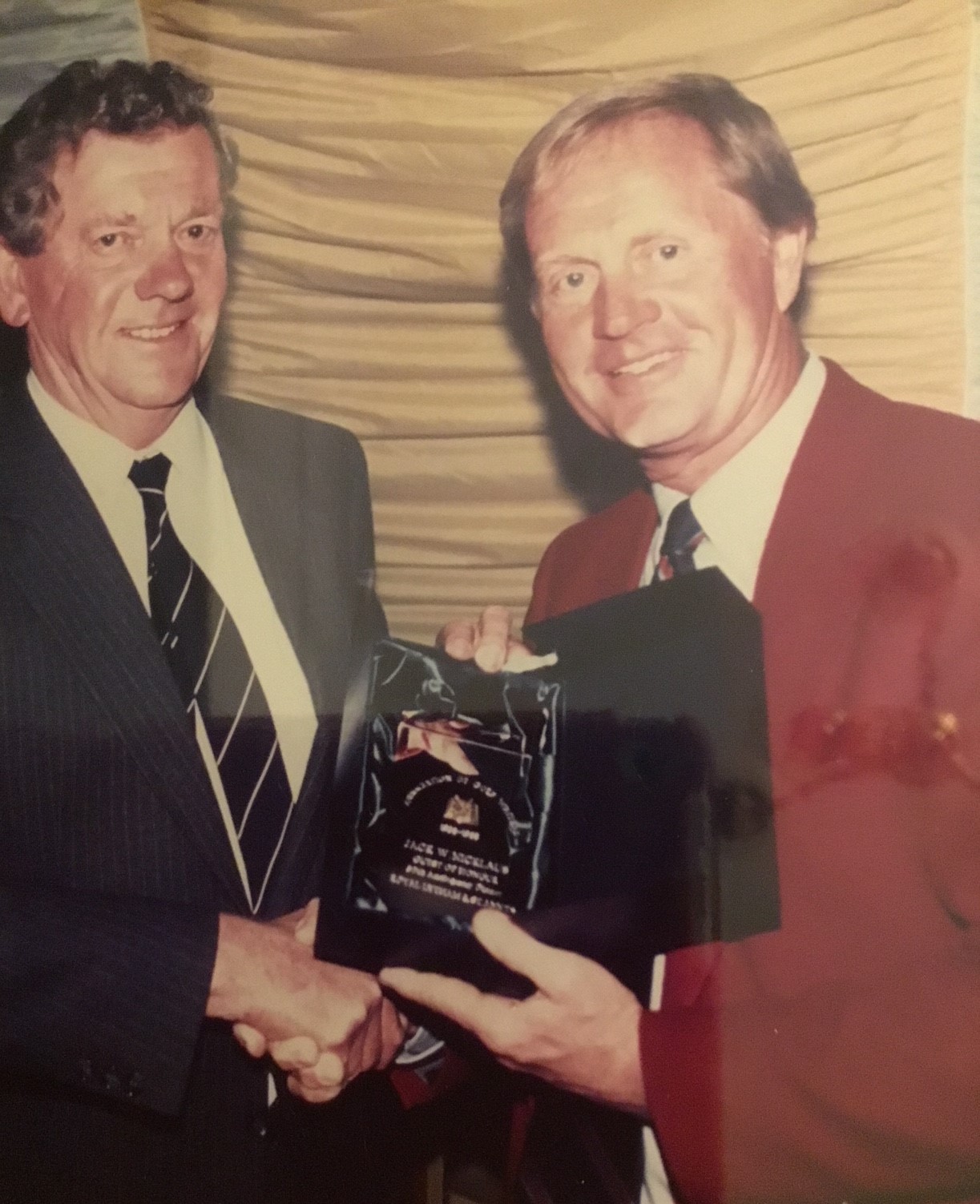 AGW Chairman Michael Williams pesents Jack NIckluas with a commemorative sterling ink well to celebrate the AGWs 50th anniversary in 1988.