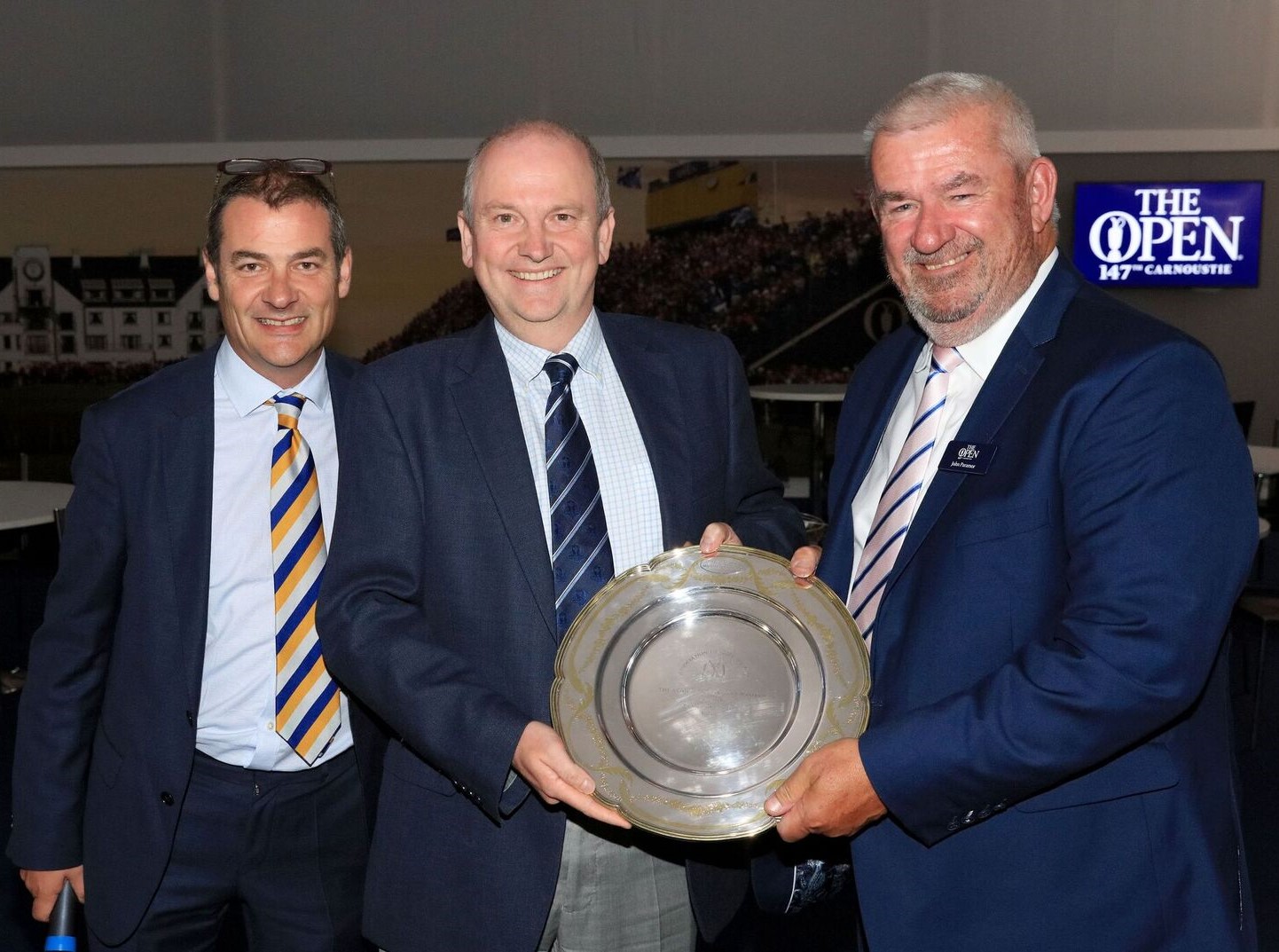AGW Chairman Iain Carter with Roddy Williams, and the son of the AGWs much-respected Michael Williams who hands the award to the European Tour's Chief Referee, John Paramor.