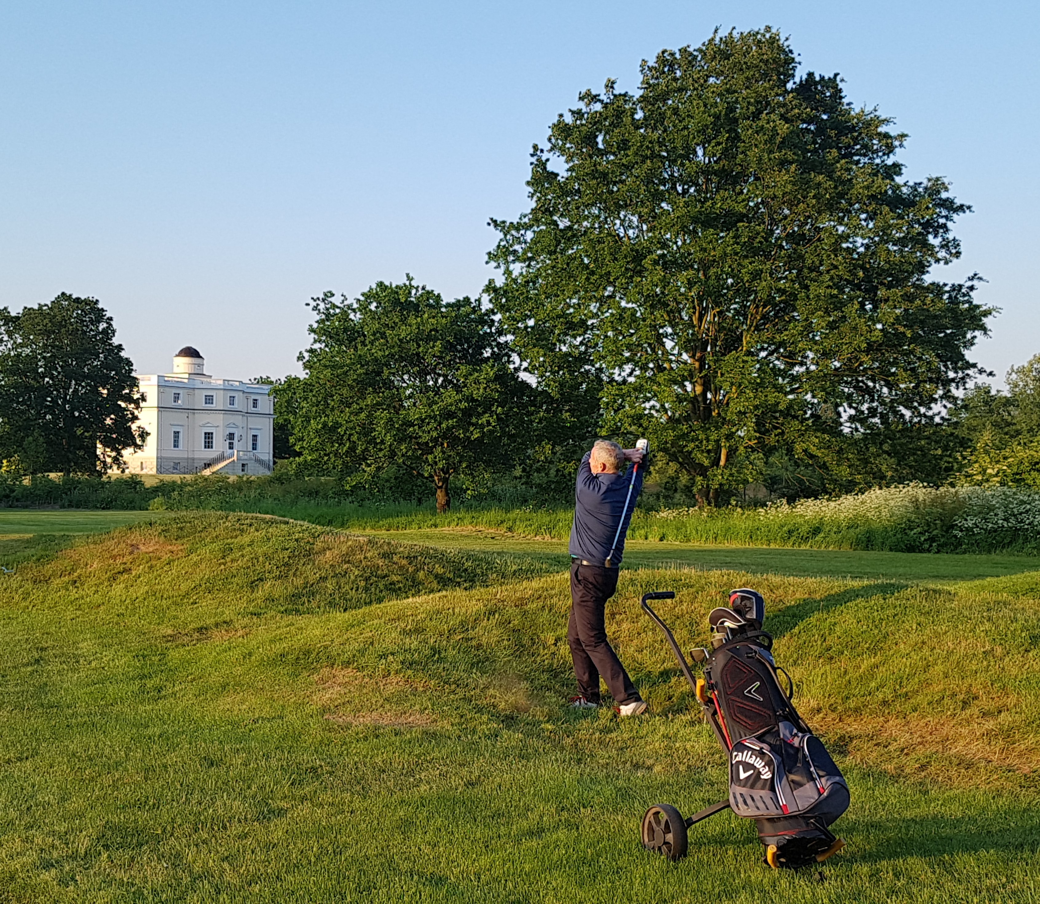 Derek Lawrenson hitting out of trouble down the right of the par-5 14th