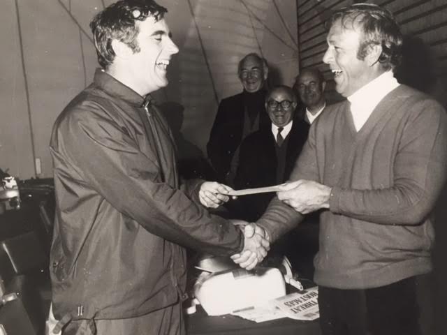 Mark Wilson shaking Arnold Palmer's hand with Peter Ryde, John Baker and Ron Moseley looking on.